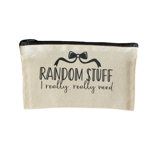 Liten tygväska med texten "Random Stuff I really, really need"